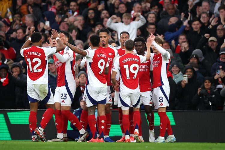 LONDON, ENGLAND: Bukayo Saka of Arsenal celebrates with his teammates after scoring his team's first goal during the Premier League match between A...