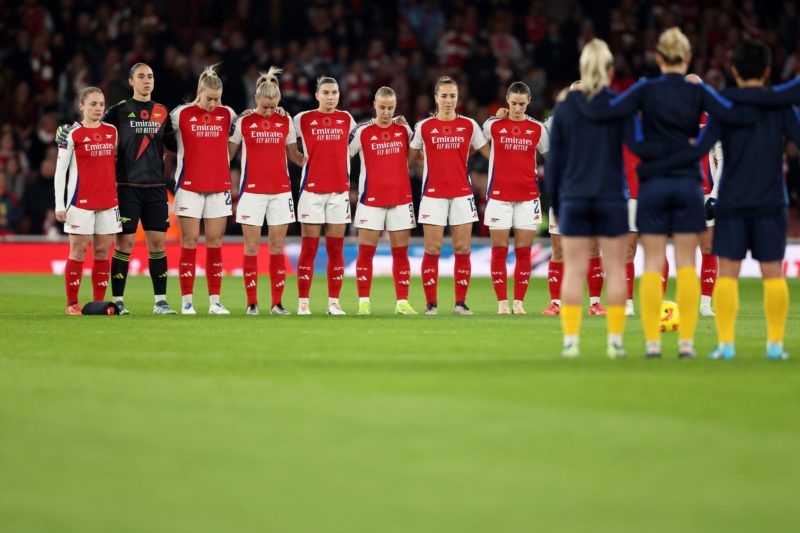 LONDON, ENGLAND - NOVEMBER 08: Players of Arsenal and Brighton & Hove Albion participate in a minute's silence for Remembrance Sunday prior to ...