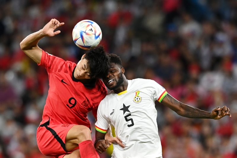 AL RAYYAN, QATAR - NOVEMBER 28: Guesung Cho of Korea Republic competes for a header against Thomas Partey of Ghana during the FIFA World Cup Qatar 2022 Group H match between Korea Republic and Ghana at Education City Stadium on November 28, 2022 in Al Rayyan, Qatar. (Photo by Claudio Villa/Getty Images)