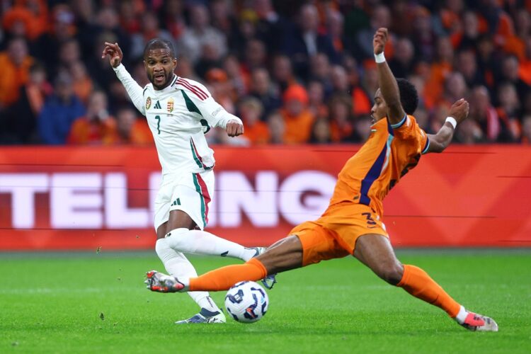 AMSTERDAM, NETHERLANDS: Loic Nego of Hungary is challenged by Jurrien Timber of Netherlands during the UEFA Nations League 2024/25 League A Group A...