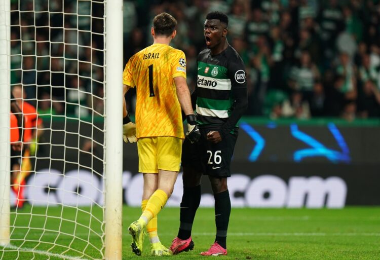 LISBON, PORTUGAL: Ousmane Diomande of Sporting CP celebrates with teammate Franco Israel after Erling Haaland of Manchester City (not pictured) mis...