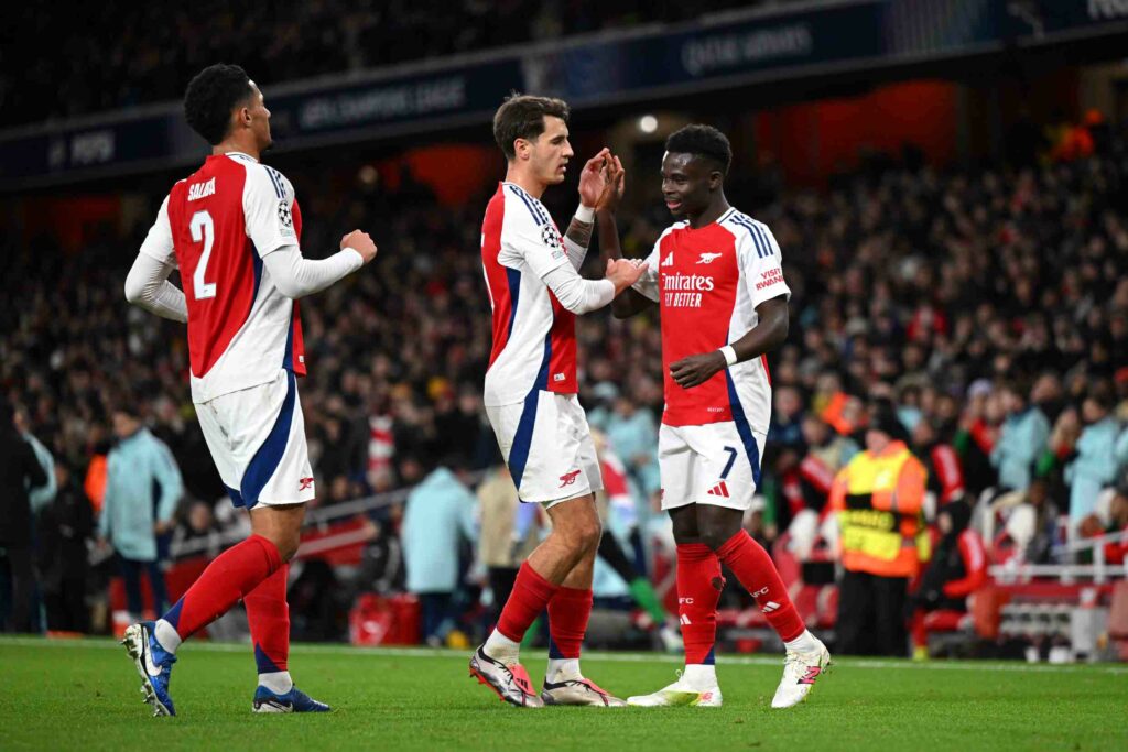 Napoli want Arsenal 24yo but move currently being held up 3 LONDON, ENGLAND - DECEMBER 11: Bukayo Saka of Arsenal celebrates scoring his team's second goal with teammate Jakub Kiwior and William Saliba during the UEFA Champions League 2024/25 League Phase MD6 match between Arsenal FC and AS Monaco at Emirates Stadium on December 11, 2024 in London, England. (Photo by Shaun Botterill/Getty Images)