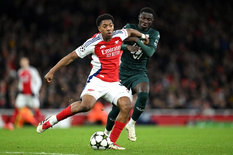 LONDON, ENGLAND: Myles Lewis-Skelly of Arsenal is challenged by Lamine Camara of AS Monaco during the UEFA Champions League 2024/25 League Phase MD...
