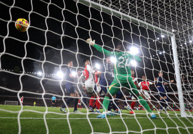 LONDON, ENGLAND - DECEMBER 04: (EDITORS NOTE: In this photo taken from a remote camera from behind the goal) A general view as Jurrien Timber of Ar...