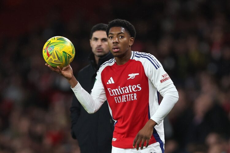LONDON, ENGLAND: Myles Lewis-Skelly of Arsenal stands in-front of Manager Mikel Arteta during the Carabao Cup Quarter Final match between Arsenal a...