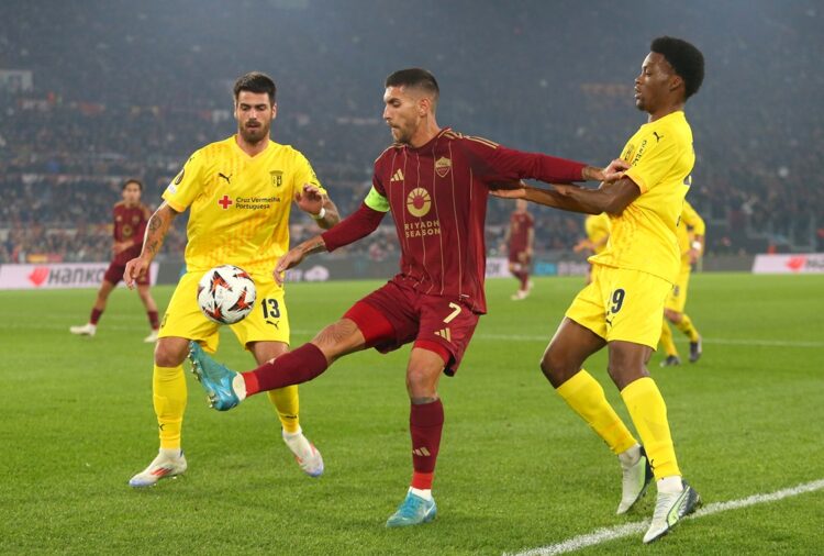 ROME, ITALY: Lorenzo Pellegrini of AS Roma is challenged by Joao Ferreira and Jean-Baptiste Gorby of SC Braga during the UEFA Europa League 2024/25...