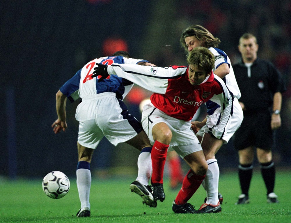 Forgotten ex-Gunner retires aged 45 2 11 Dec 2001: Tugay and Jeff Kenna of Blackburn clash with Junichi Inamoto of Arsenal during the Blackburn Rovers v Arsenal Worthington Cup Quarter Final match at Ewood Park, Blackburn. Photo: Michael Steele/ALLSPORT