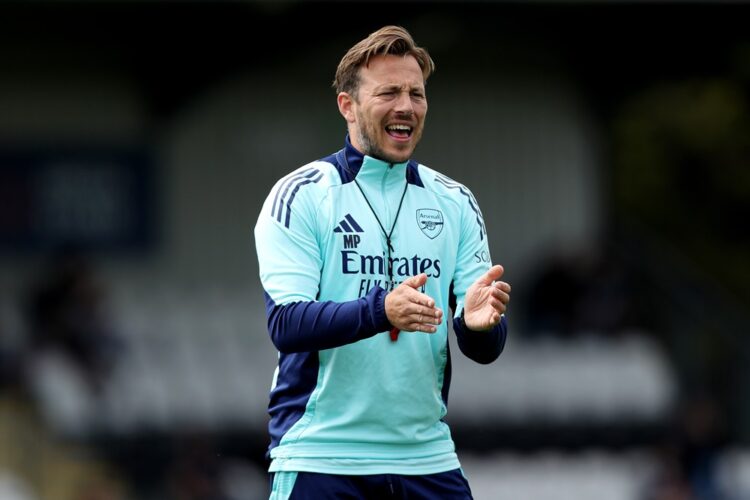 BOREHAMWOOD, ENGLAND: Max Porter, Coach of Arsenal XI, applauds prior to the Pre-Season Friendly match between Boreham Wood and Arsenal XI at Meado...