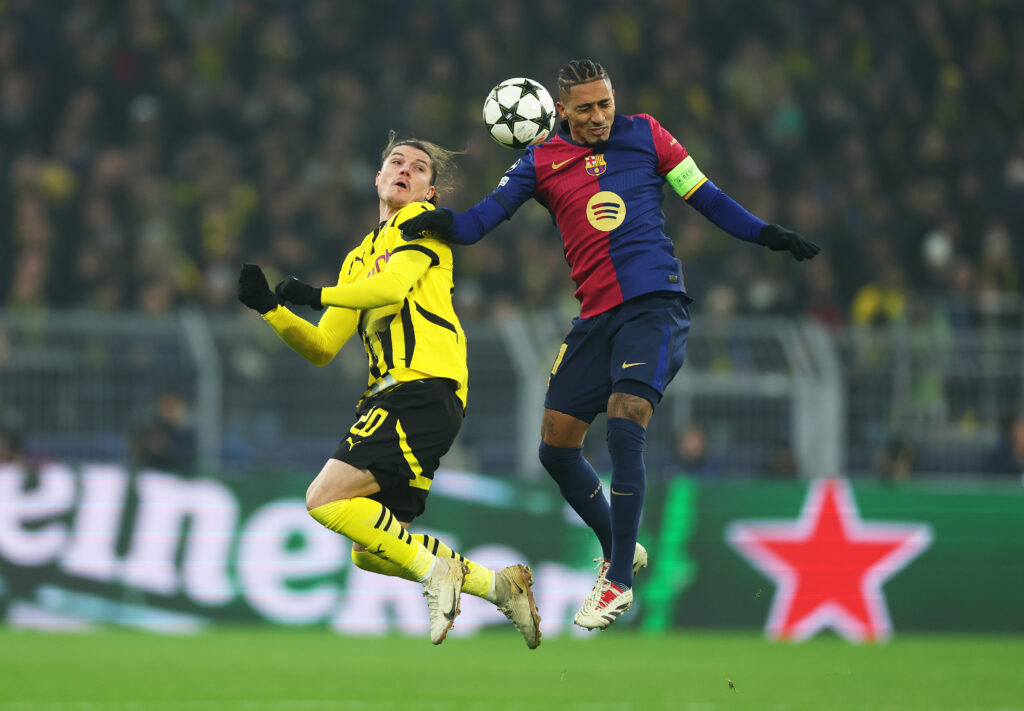 Arsenal test the waters for electric Barcelona winger signing 2 DORTMUND, GERMANY - DECEMBER 11: Raphinha of FC Barcelona contends for the aerial ball with Marcel Sabitzer of Borussia Dortmund during the UEFA Champions League 2024/25 League Phase MD6 match between Borussia Dortmund and FC Barcelona at BVB Stadion Dortmund on December 11, 2024 in Dortmund, Germany. (Photo by Lars Baron/Getty Images)