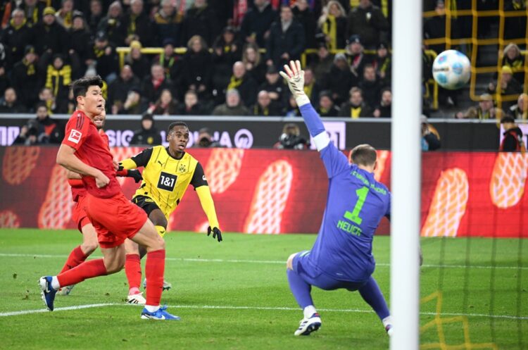 DORTMUND, GERMANY: Jamie Bynoe-Gittens of Borussia Dortmund scores his team's first goal during the Bundesliga match between Borussia Dortmund and ...
