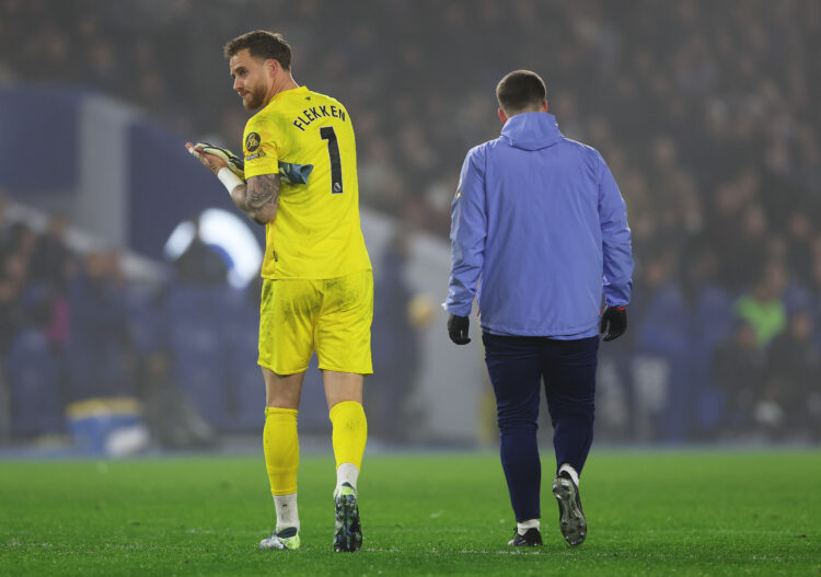 BRIGHTON, ENGLAND - DECEMBER 27: Mark Flekken of Brentford applauds the fans as he leaves the pitch after picking up an injury during the Premier L...