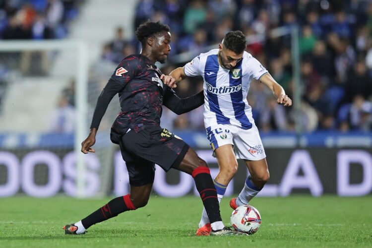 LEGANES, SPAIN: Munir El Haddadi of CD Leganes is challenged by Lucien Agoume of Sevilla FC during the LaLiga match between CD Leganes and Sevilla ...