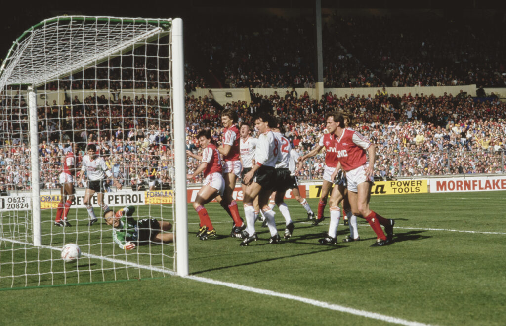 Arsenal Carabao Cup semi-final fixture details v Newcastle confirmed 3 LONDON, ENGLAND - APRIL 05: Arsenal striker Charlie Nicholas (next to post) scores the first Arsenal goal past Liverpool goalkeeper Bruce Grobbelaar as Tony Adams (next to Nicholas) looks on during the 1987 Littlewoods Cup Final on April 5th, 1987 in London, United Kingdom. (Photo by Allsport/Getty Images/Hulton Archive)
