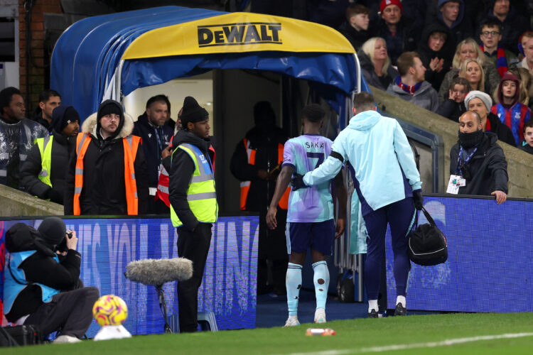 LONDON, ENGLAND - DECEMBER 21: A general view as Bukayo Saka of Arsenal is assisted as he walks down the tunnel as he leaves the field following me...