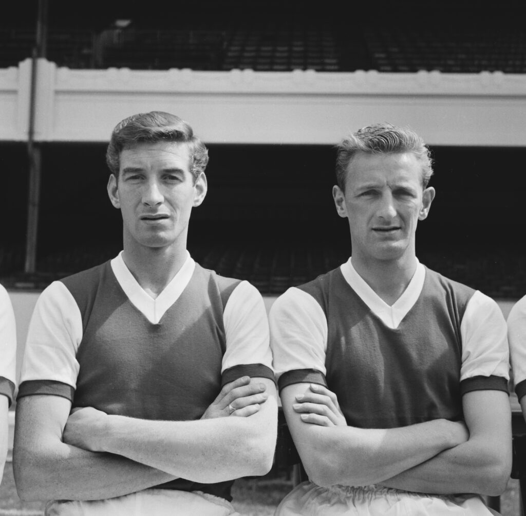 British footballer Geoff Strong (1937-2013, Arsenal forward, and British footballer George Eastham, Arsenal midfielder, ahead of the English League Division One season, at Highbury in London, England, 8th August 1962. (Photo by Evening Standard/Hulton Archive/Getty Images)