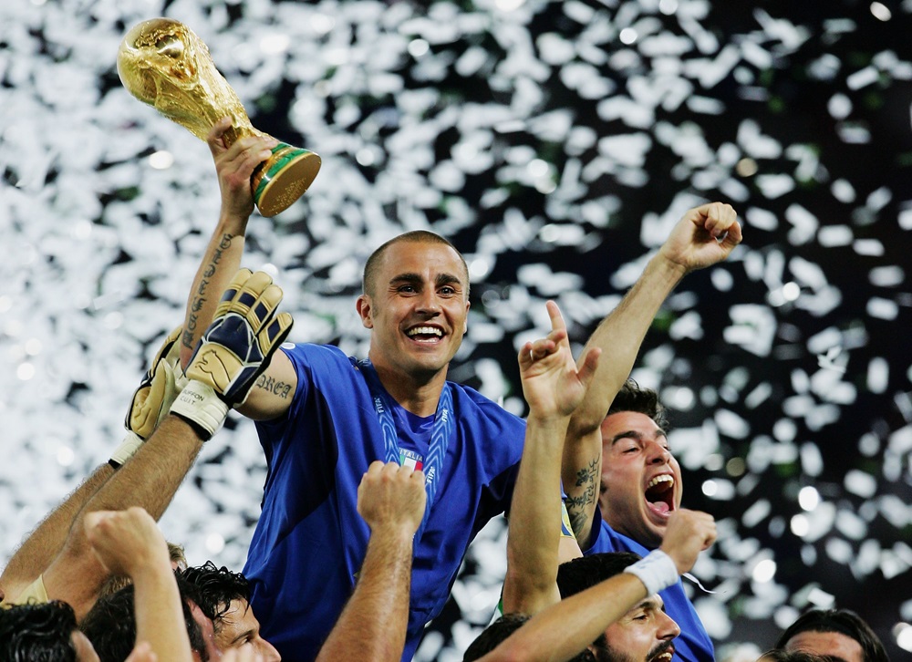 BERLIN: The Italian players celebrate as Fabio Cannavaro of Italy lifts the World Cup trophy aloft following victory in a penalty shootout at the end of the FIFA World Cup Germany 2006 Final match between Italy and France at the Olympic Stadium on July 9, 2006. (Photo by Alex Livesey/Getty Images)