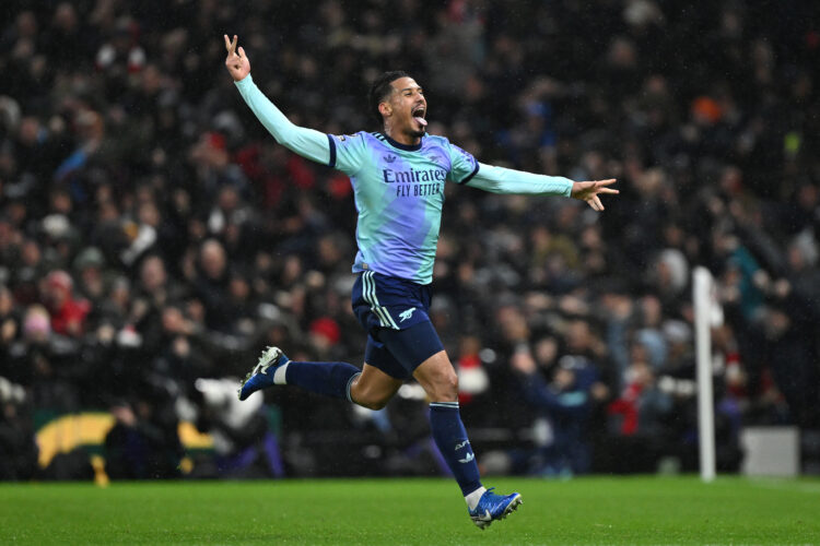 LONDON, ENGLAND - DECEMBER 08: William Saliba of Arsenal celebrates are Bukayo Saka of Arsenal (not pictured) scores a goal, which was later ruled ...