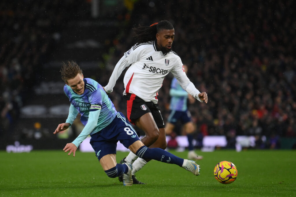 Arsenal fan favourite picks surprising career highlight 4 LONDON, ENGLAND - DECEMBER 08: Martin Odegaard of Arsenal is challenged by Alex Iwobi of Fulham during the Premier League match between Fulham FC and Arsenal FC at Craven Cottage on December 08, 2024 in London, England. (Photo by Mike Hewitt/Getty Images)