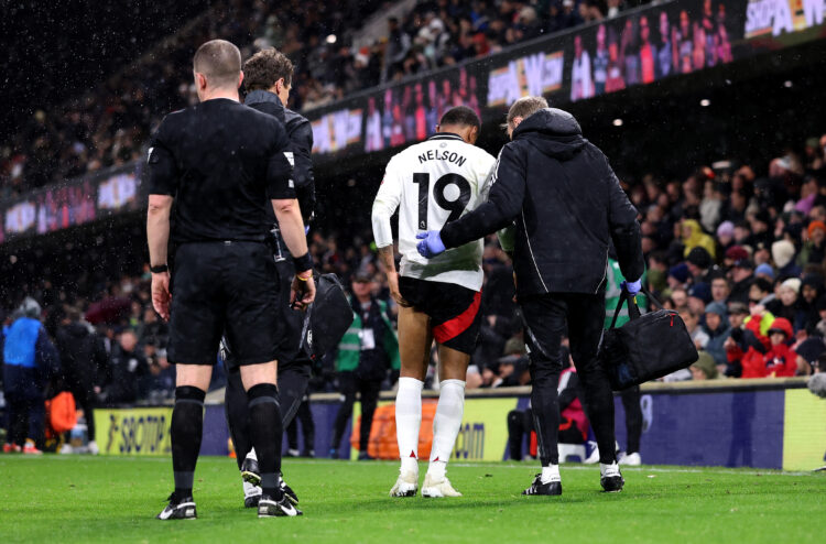 LONDON, ENGLAND - DECEMBER 05: Reiss Nelson of Fulham receives medical attention off the pitch during the Premier League match between Fulham FC an...