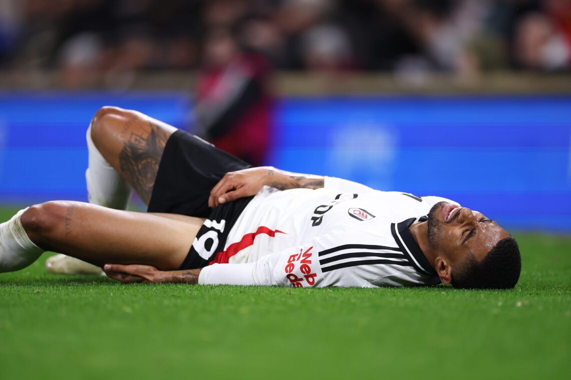 LONDON, ENGLAND - DECEMBER 05: Reiss Nelson of Fulham goes down with an injury during the Premier League match between Fulham FC and Brighton &...