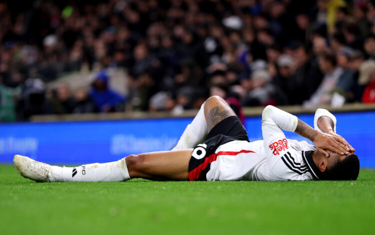 LONDON, ENGLAND - DECEMBER 05: Reiss Nelson of Fulham goes down with an injury during the Premier League match between Fulham FC and Brighton &...
