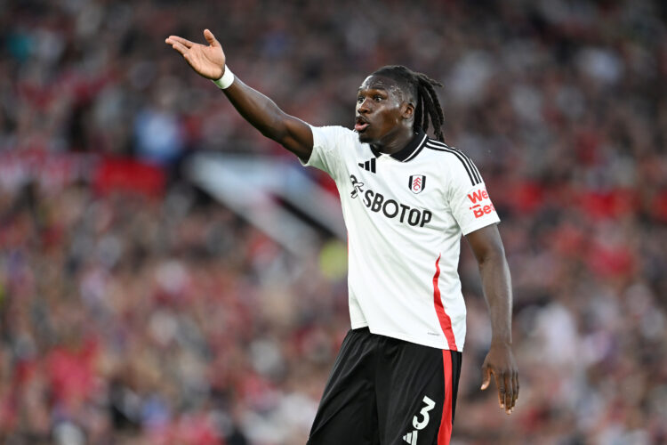 MANCHESTER, ENGLAND - AUGUST 16: Calvin Bassey of Fulham in action during the Premier League match between Manchester United FC and Fulham FC at Ol...