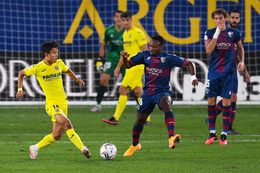 Former Arsenal prodigy finally gets to play in England 3 VILLAREAL, SPAIN - SEPTEMBER 13: Takefusa Kubo of Villarreal CF competes for the ball with Kelechi Nwakali of SD Huesca during the La Liga match between Villarreal CF and SD Huesca at Estadio de la Ceramica on September 13, 2020 in Villareal, Spain. (Photo by Alex Caparros/Getty Images)