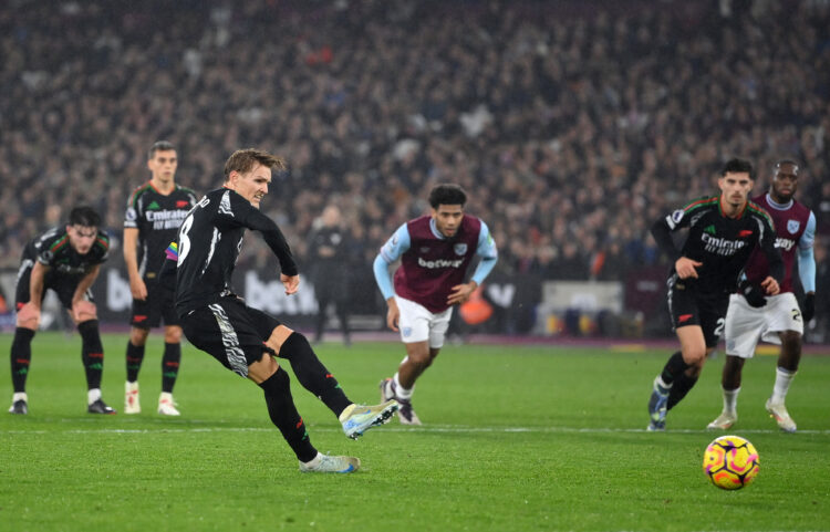LONDON, ENGLAND - NOVEMBER 30: Martin Odegaard of Arsenal scores his team's third goal from a penalty kick during the Premier League match between ...