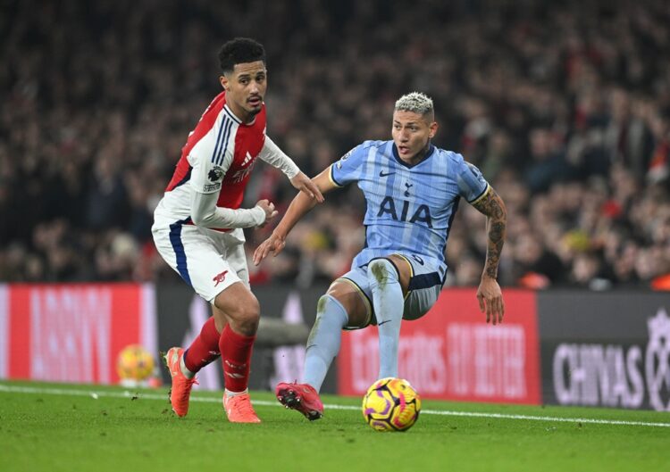 LONDON, ENGLAND: William Saliba of Arsenal battles for possession with Richarlison of Tottenham Hotspur during the Premier League match between Ars...