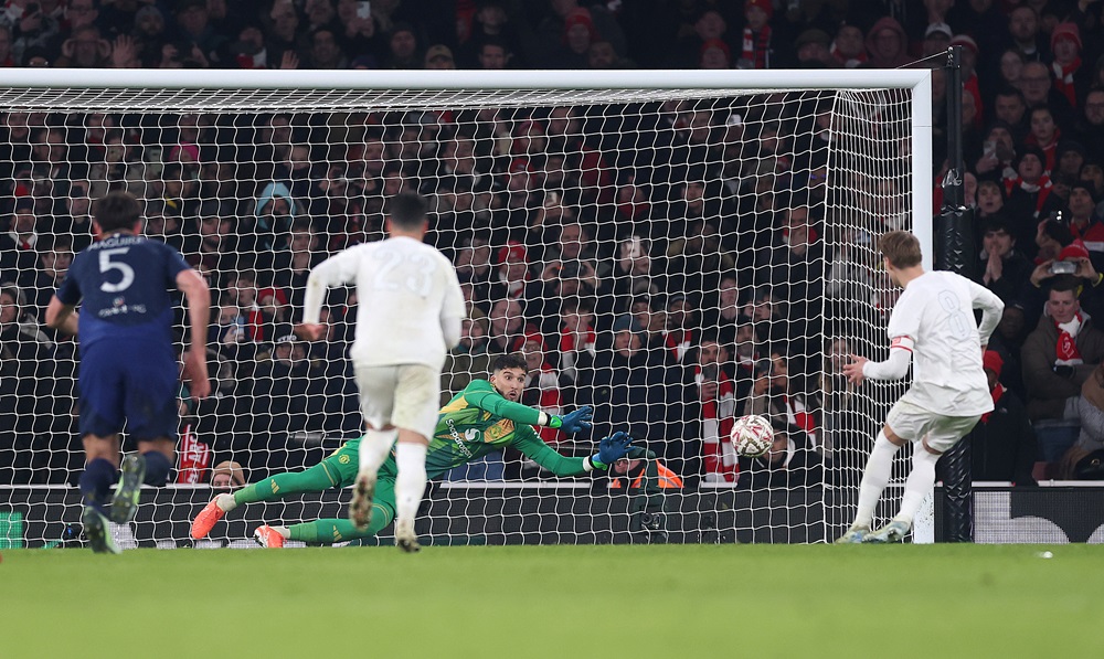 LONDON, ENGLAND: Martin Odegaard of Arsenal has his penalty saved by goalkeeper Altay Bayindir of Manchester United during the Emirates FA Cup Third Round match between Arsenal and Manchester United at Emirates Stadium on January 12, 2025. (Photo by Julian Finney/Getty Images)