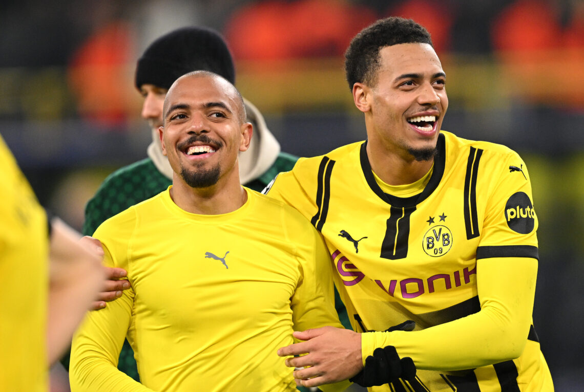DORTMUND, GERMANY - NOVEMBER 05: Donyell Malen and Felix Nmecha of Borussia Dortmund celebrate at full-time following the team's victory in the UEF...
