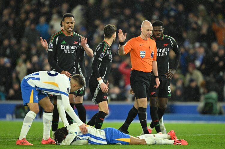 BRIGHTON, ENGLAND: Jorginho and Thomas Partey of Arsenal speak with Referee Anthony Taylor after awarding a penalty to Brighton & Hove Albion as Jo...