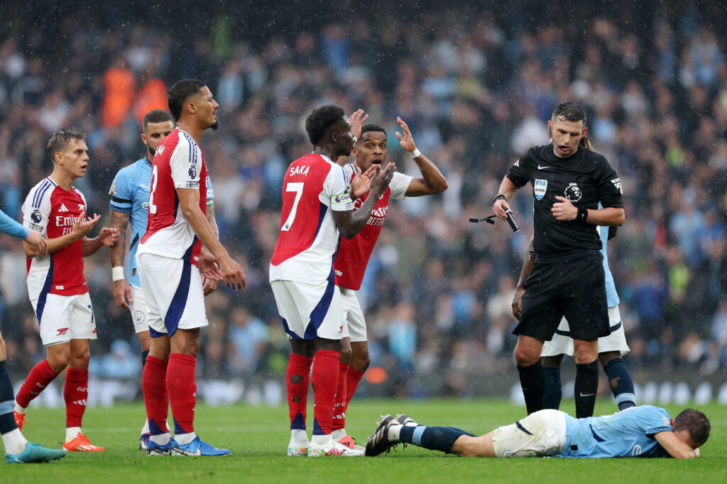 Bernardo Silva is right to complain this time 4 MANCHESTER, ENGLAND - SEPTEMBER 22: Bernardo Silva of Manchester City reacts prior to Referee, Michael Oliver showing a red card to Leandro Trossard of Arsenal during the Premier League match between Manchester City FC and Arsenal FC at Etihad Stadium on September 22, 2024 in Manchester, England. (Photo by Carl Recine/Getty Images)