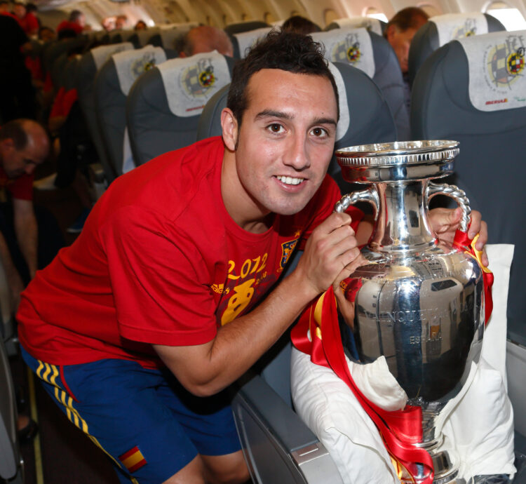 IN FLIGHT - JULY 02: In this handout image supplied by the Royal Spanish Football Federation, Santi Cazorla of Spain poses with the trophy followin...