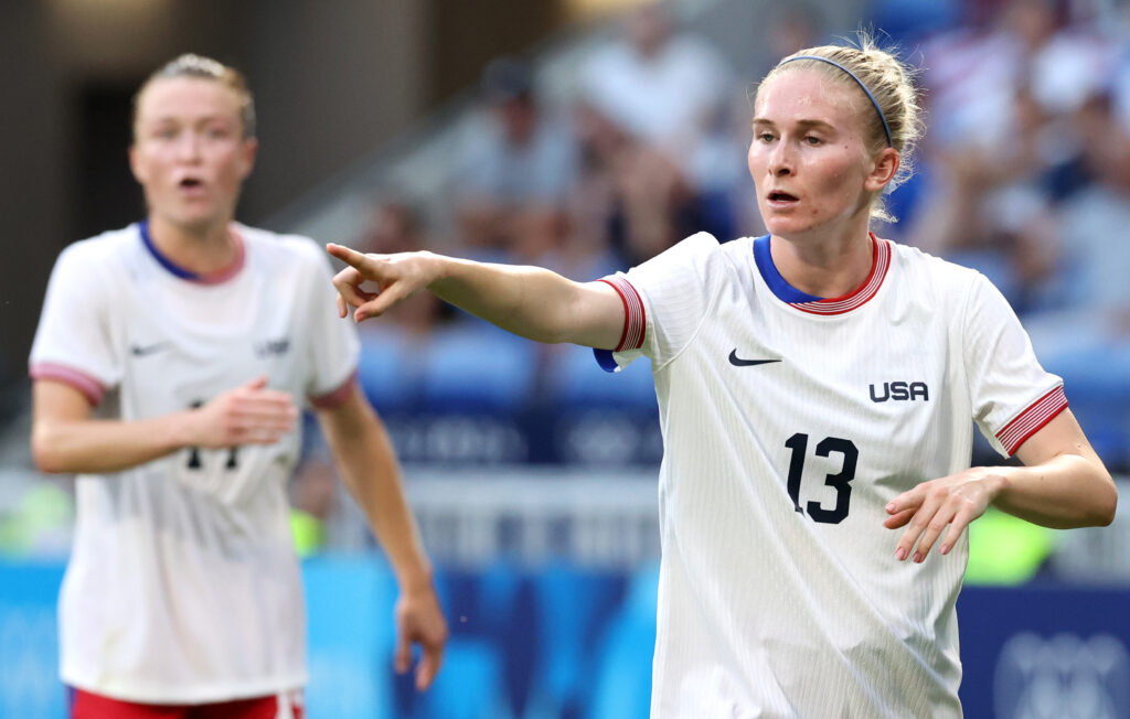 LYON, FRANCE - AUGUST 06: Jenna Nighswonger #13 of Team United States gestures to her teammates during the Women's semifinal match between United States of America and Germany during the Olympic Games Paris 2024 at Stade de Lyon on August 06, 2024 in Lyon, France. (Photo by Claudio Villa/Getty Images)