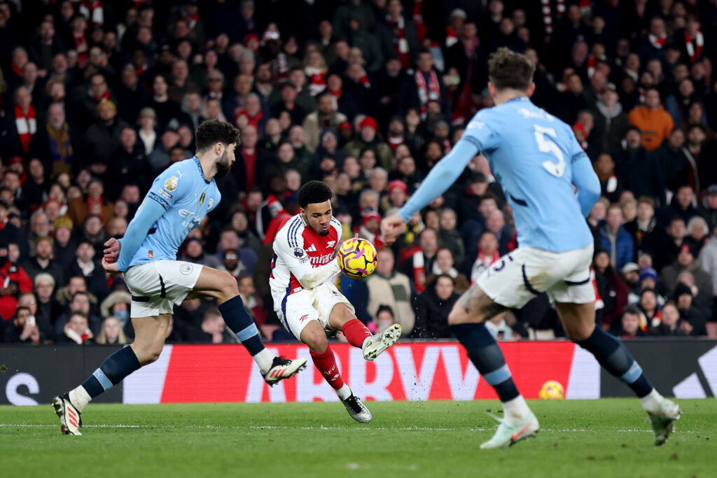 LONDON, ENGLAND - FEBRUARY 02: Ethan Nwaneri of Arsenal scores his team's fifth goal whilst under pressure from Josko Gvardiol of Manchester City during the Premier League match between Arsenal FC and Manchester City FC at Emirates Stadium on February 02, 2025 in London, England. (Photo by Alex Pantling/Getty Images)