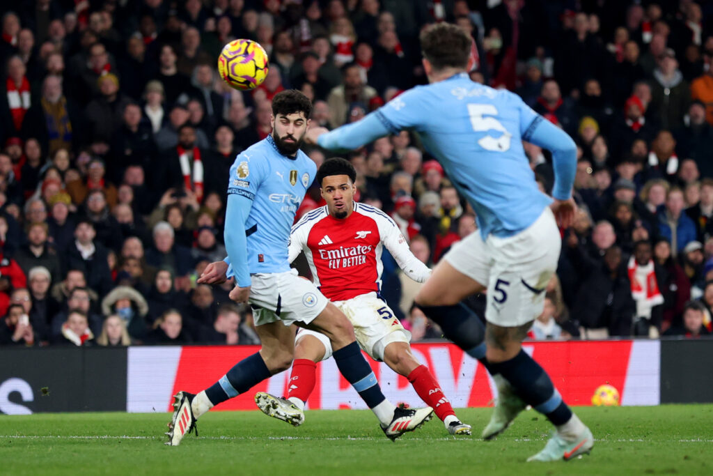 LONDON, ENGLAND - FEBRUARY 02: Ethan Nwaneri of Arsenal scores his team's fifth goal whilst under pressure from Josko Gvardiol of Manchester City during the Premier League match between Arsenal FC and Manchester City FC at Emirates Stadium on February 02, 2025 in London, England. (Photo by Alex Pantling/Getty Images)