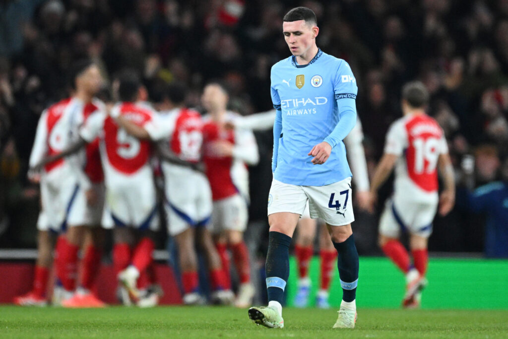 Manchester City charges verdict now expected soon 2 LONDON, ENGLAND - FEBRUARY 02: Phil Foden of Manchester City looks dejected as Myles Lewis-Skelly of Arsenal (obscured) celebrates scoring his team's third goal with teammates during the Premier League match between Arsenal FC and Manchester City FC at Emirates Stadium on February 02, 2025 in London, England. (Photo by Justin Setterfield/Getty Images)