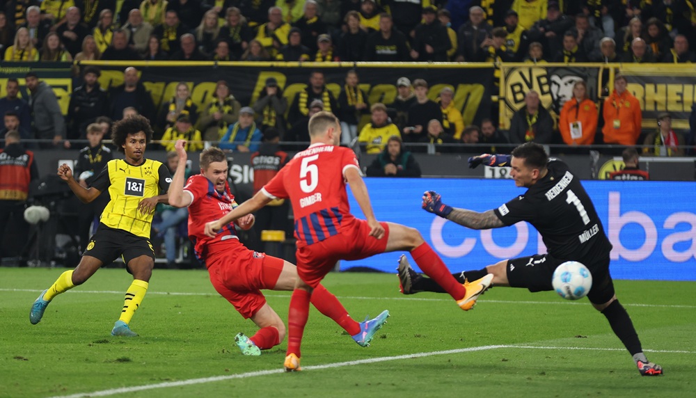 DORTMUND, GERMANY: Karim Adeyemi of Dortmund scores his team's second goal during the Bundesliga match between Borussia Dortmund and 1. FC Heidenheim 1846 at Signal Iduna Park on September 13, 2024. (Photo by Lars Baron/Getty Images)