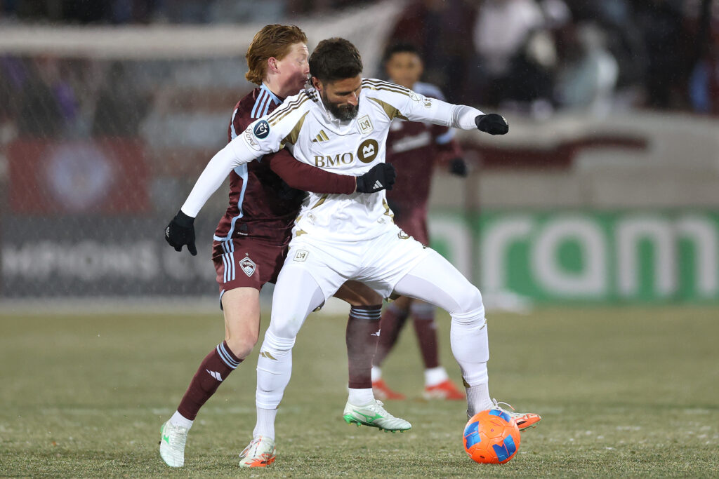 COMMERCE CITY, COLORADO - FEBRUARY 18: Olivier Giroud #9 of LAFC fights for control of the ball against Oliver Larraz #8 of the Colorado Rapids in the first half during the 2025 Concacaf Champions Cup at Dick's Sporting Goods Park on February 18, 2025 in Commerce City, Colorado. (Photo by Matthew Stockman/Getty Images)