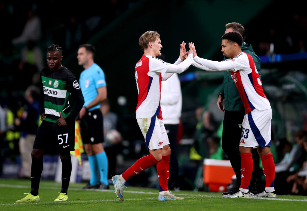 LISBON, PORTUGAL - NOVEMBER 26: Martin Odegaard of Arsenal interacts with Ethan Nwaneri as he leaves the field as a substitution takes place during the UEFA Champions League 2024/25 League Phase MD5 match between Sporting Clube de Portugal and Arsenal FC at Estadio Jose Alvalade on November 26, 2024 in Lisbon, Portugal. (Photo by Alex Pantling/Getty Images)