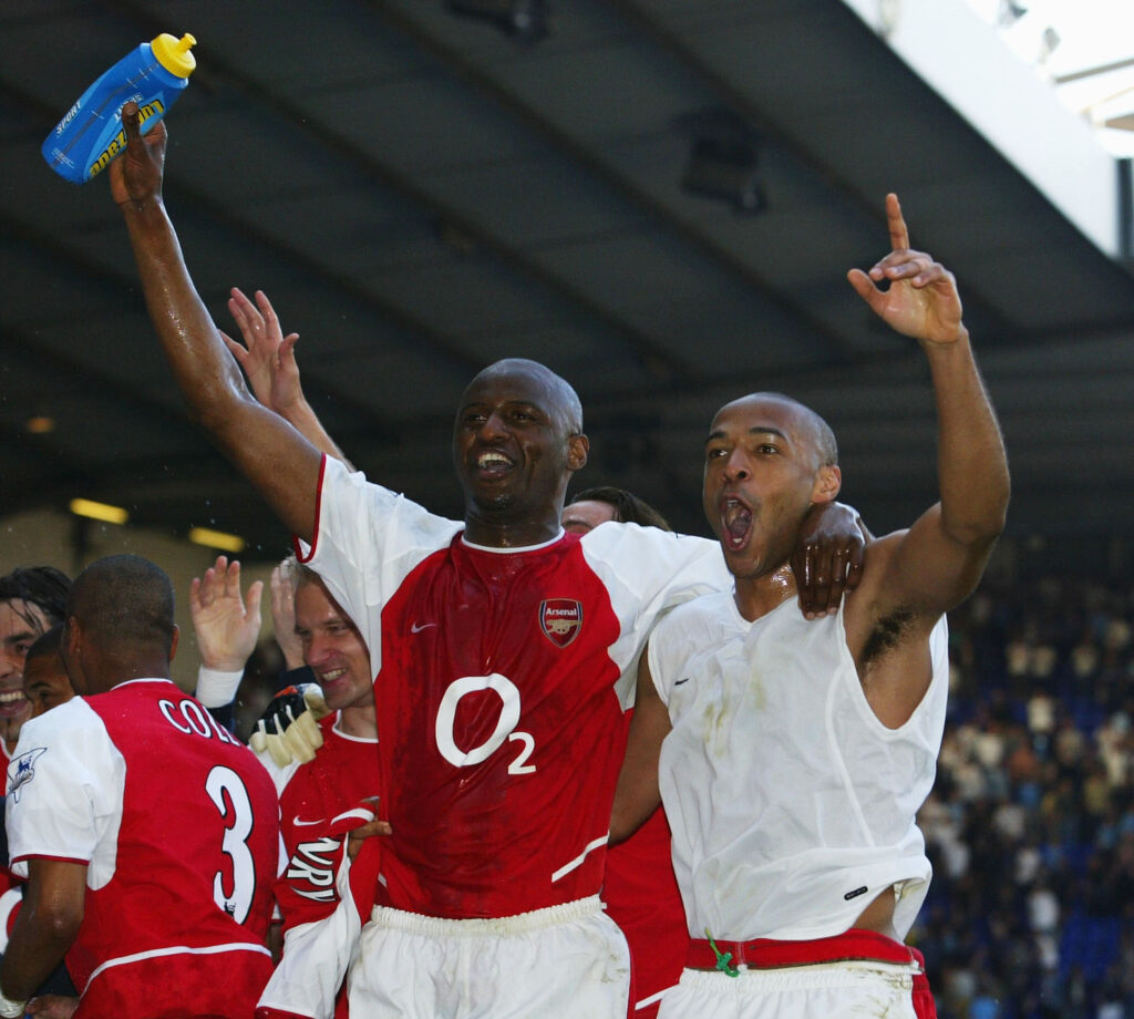 LONDON - APRIL 25: Thierry Henry and Patrick Vieira of Arsenal celebrates with team-mates at the end of the FA Barclaycard Premiership match between Tottenham Hotspur and Arsenal at White Hart Lane on April 25, 2004 in London. (Photo by Shaun Botterill/Getty Images)