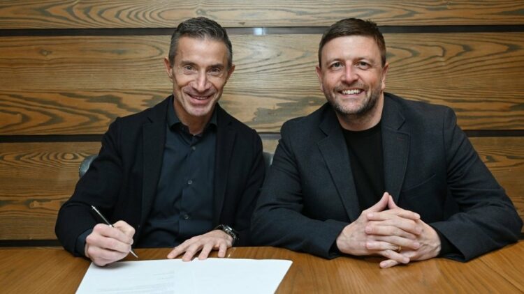 Andrea Berta signs for Arsenal as the club's new sporting director (Photo via Arsenal.com)