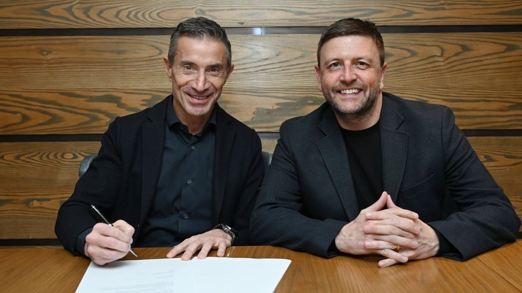 Andrea Berta signs for Arsenal as the club's new sporting director (Photo via Arsenal.com)