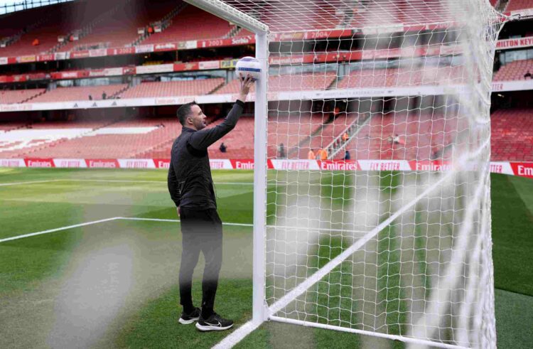 LONDON, ENGLAND - MARCH 16: Referee, Chris Kavanagh checks the GDS prior to the Premier League match between Arsenal FC and Chelsea FC at Emirates ...