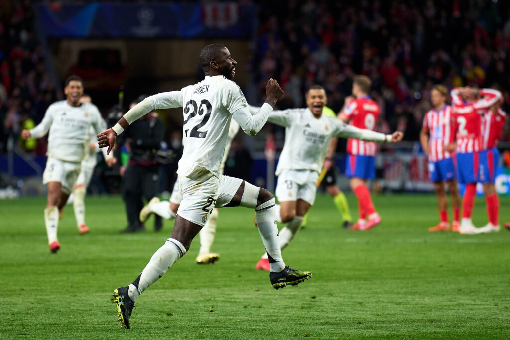 Latest as 4 Real Madrid players face UEFA ban before Arsenal game 4 MADRID, SPAIN - MARCH 12: Antonio Ruediger of Real Madrid celebrates after scoring his sides fifth and winning penalty in the penalty shoot out during the UEFA Champions League 2024/25 UEFA Champions League 2024/25 Round of 16 second leg match between Atletico de Madrid and Real Madrid C.F. at Riyadh Air Metropolitano on March 12, 2025 in Madrid, Spain. (Photo by Angel Martinez/Getty Images)