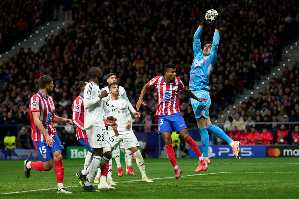 New Real Madrid injury clouds plans ahead of Arsenal showdown 2 MADRID, SPAIN - MARCH 12: Thibaut Courtois of Real Madrid catches the ball whilst under pressure from Reinildo Mandava of Atletico de Madrid during the UEFA Champions League 2024/25 UEFA Champions League 2024/25 Round of 16 second leg match between Atletico de Madrid and Real Madrid C.F. at Riyadh Air Metropolitano on March 12, 2025 in Madrid, Spain. (Photo by Angel Martinez/Getty Images)