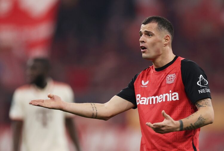 MUNICH, GERMANY: Granit Xhaka of Bayer 04 Leverkusen reacts during the UEFA Champions League 2024/25 Round of 16 first leg match between FC Bayern ...