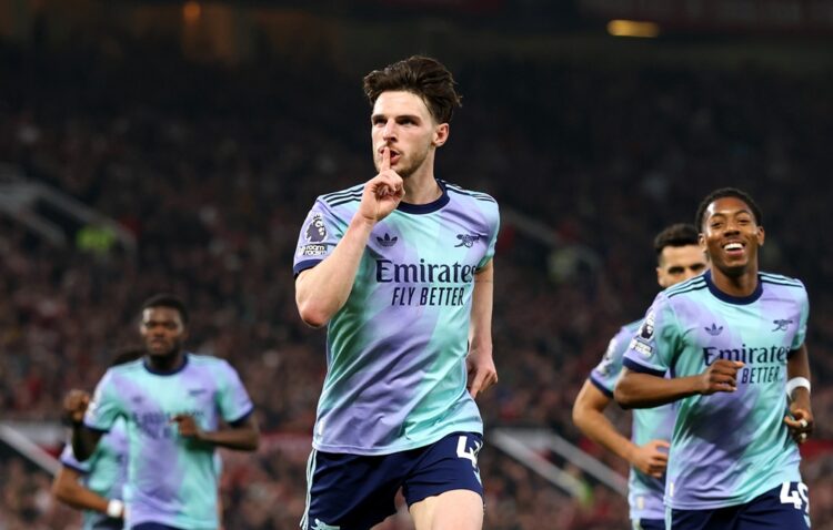MANCHESTER, ENGLAND: Declan Rice of Arsenal celebrates scoring his team's first goal during the Premier League match between Manchester United FC a...