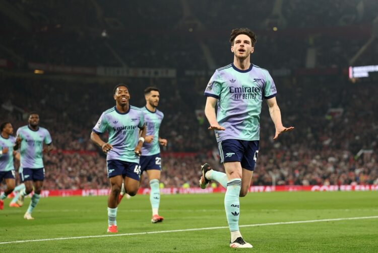MANCHESTER, ENGLAND: Declan Rice of Arsenal celebrates scoring his team's first goal during the Premier League match between Manchester United FC a...